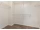 Walk-in closet with carpeted floors and wire shelving at 7029 S Golfside Ln, Phoenix, AZ 85042
