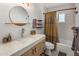 Updated bathroom features modern fixtures, open shelving, and tiled shower at 7707 E Earll Dr, Scottsdale, AZ 85251