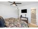 Cozy bedroom with modern décor, featuring a view to the bathroom at 7707 E Earll Dr, Scottsdale, AZ 85251