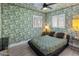 Bedroom with large windows, ceiling fan, and striking wallpaper at 7707 E Earll Dr, Scottsdale, AZ 85251