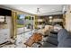 Spacious living room leading to an outdoor patio, with eye-catching furniture and bunk beds at 7707 E Earll Dr, Scottsdale, AZ 85251