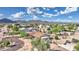 Expansive desert home featuring a low-pitched roof and mature native trees at 833 N 110Th St, Mesa, AZ 85207