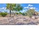 Inviting backyard patio with seating around a firepit, perfect for outdoor entertaining and relaxation at 833 N 110Th St, Mesa, AZ 85207