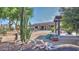 Desert landscaped backyard with decorative rocks, cacti and natural desert plants with a covered outdoor patio at 833 N 110Th St, Mesa, AZ 85207