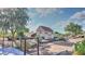 View of backyard shed, desert landscaping and a decorative fence at 833 N 110Th St, Mesa, AZ 85207