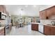 Eat-in kitchen features wooden cabinets, modern appliances and a dining area at 833 N 110Th St, Mesa, AZ 85207