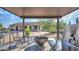 Covered patio with outdoor kitchen and stainless grill overlooking backyard at 833 N 110Th St, Mesa, AZ 85207