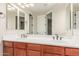 Bathroom features double sink vanity, cherry wood cabinets, and bronze faucets at 915 W Orchard Ln, Litchfield Park, AZ 85340