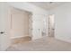 Inviting bedroom providing multiple doorways and ensuite bathroom access at 915 W Orchard Ln, Litchfield Park, AZ 85340