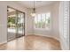 Dining area bathed in natural light, with a sliding glass door offering a view of the sparkling pool at 915 W Orchard Ln, Litchfield Park, AZ 85340