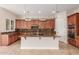 Stylish kitchen featuring granite countertops, modern appliances, and a central island at 915 W Orchard Ln, Litchfield Park, AZ 85340