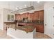 Spacious kitchen with a large island, custom cabinets, and stainless steel appliances at 915 W Orchard Ln, Litchfield Park, AZ 85340