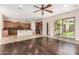Open-concept layout featuring a living room and a kitchen area with stainless steel appliances at 915 W Orchard Ln, Litchfield Park, AZ 85340