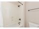 Bathroom shower with showerhead, new fixtures, and a white bathtub at 915 W Orchard Ln, Litchfield Park, AZ 85340