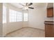 Bright dining space with large windows, tile floor and a ceiling fan at 925 S Longmore -- # 201, Mesa, AZ 85202