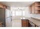 Bright eat-in kitchen area with stainless steel refrigerator and lots of natural light at 925 S Longmore -- # 201, Mesa, AZ 85202