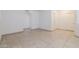 Neutral living space with arched doorway, closet and tile flooring at 925 S Longmore -- # 201, Mesa, AZ 85202