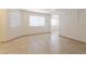 Bright living room featuring tile flooring, neutral walls, and natural light from large windows at 925 S Longmore -- # 201, Mesa, AZ 85202