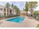 Inviting community pool surrounded by lush landscaping and lounge chairs at 925 S Longmore -- # 201, Mesa, AZ 85202