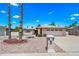 Charming single-story home with a well-maintained landscape and attached garage, showcasing its inviting curb appeal at 9654 E Foster Ave, Sun Lakes, AZ 85248