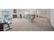 Spacious living room featuring a fireplace, carpet flooring, and comfortable seating, perfect for relaxation and gatherings at 9654 E Foster Ave, Sun Lakes, AZ 85248