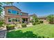 Expansive backyard with patio, lush lawn, and well-maintained landscaping at 974 W Zion Way, Chandler, AZ 85248