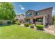 Spacious backyard with lush lawn, patio, and outdoor kitchen, perfect for entertaining at 974 W Zion Way, Chandler, AZ 85248
