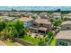 Aerial shot of a landscaped backyard with a patio, outdoor seating, and lush green lawn, perfect for entertaining at 974 W Zion Way, Chandler, AZ 85248