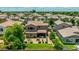 Aerial view of a beautifully landscaped backyard with a patio, outdoor seating, and a well-manicured lawn at 974 W Zion Way, Chandler, AZ 85248
