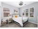 Bright bedroom features a white iron bed frame, three windows, and soft, neutral decor at 974 W Zion Way, Chandler, AZ 85248