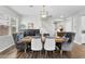 Formal dining space with wood table, stylish seating, modern light fixture, and built in buffet at 974 W Zion Way, Chandler, AZ 85248