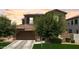 Beautiful two-story house featuring a two-car garage, maintained lawn, and lovely mature trees at 974 W Zion Way, Chandler, AZ 85248