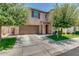 Charming two-story home featuring a two-car garage, well-maintained lawn, and mature trees at 974 W Zion Way, Chandler, AZ 85248