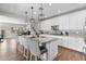 Bright, modern kitchen featuring a large island with seating, granite counters, and stainless steel appliances at 974 W Zion Way, Chandler, AZ 85248