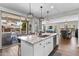 Modern kitchen with granite counters, pendant lights, and sliding glass doors to the outdoor living space at 974 W Zion Way, Chandler, AZ 85248