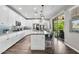The bright kitchen includes a large island, stainless steel appliances, and backyard patio access at 974 W Zion Way, Chandler, AZ 85248
