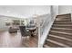 Open concept living spaces offer a spacious dining area and living room with wood-look tile flooring at 974 W Zion Way, Chandler, AZ 85248