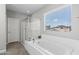 Bright bathroom with a luxurious soaking tub and a separate glass shower at 974 W Zion Way, Chandler, AZ 85248