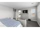 Spacious main bedroom featuring a dresser, television, and ensuite bathroom at 974 W Zion Way, Chandler, AZ 85248