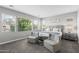 Serene main bedroom with light gray walls, large windows, two chairs, and a king sized bed at 974 W Zion Way, Chandler, AZ 85248