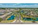 Aerial view of a Primary-planned community with water features, palm tree-lined streets, and luxury homes at 974 W Zion Way, Chandler, AZ 85248