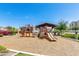 Community playground with slides, climbing structures, and a soft wood chip surface at 974 W Zion Way, Chandler, AZ 85248