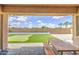 Backyard area with putting green and outdoor patio furniture at 9845 E Thistle Ave, Mesa, AZ 85212