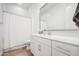 Modern bathroom featuring a vanity with quartz countertop and a shower with white subway tile at 9845 E Thistle Ave, Mesa, AZ 85212