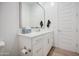 Stylish powder room featuring white cabinetry, quartz countertops, and modern fixtures at 9845 E Thistle Ave, Mesa, AZ 85212