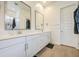 Dual sinks and vanities offer plenty of counter space in this pristine bathroom at 9845 E Thistle Ave, Mesa, AZ 85212