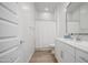 Modern bathroom featuring a vanity with quartz countertop and a shower with white subway tile at 9845 E Thistle Ave, Mesa, AZ 85212