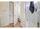 This bathroom has a modern stand-up shower with sleek white tiling at 9845 E Thistle Ave, Mesa, AZ 85212