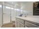 Bright bathroom featuring a glass-enclosed shower and a modern vanity at 9845 E Thistle Ave, Mesa, AZ 85212
