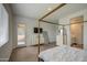 Spacious primary bedroom offers patio access, television, and an ensuite bathroom at 9845 E Thistle Ave, Mesa, AZ 85212